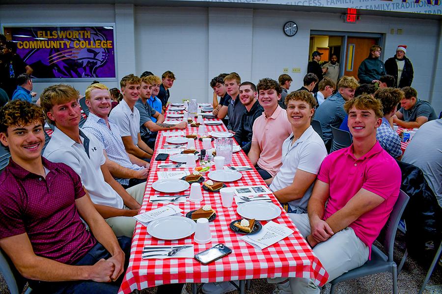 Students gathered at a table during our Holiday Dinner. 