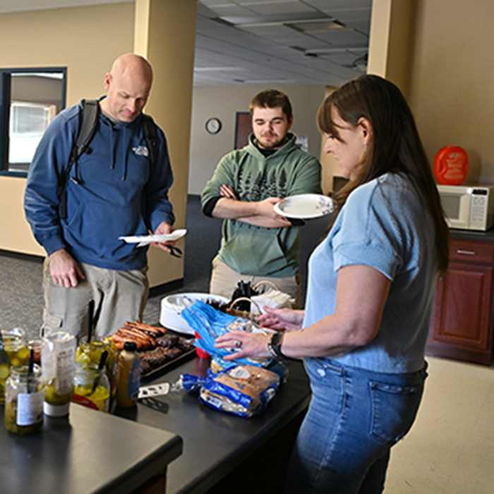 students-at-bbq-eating-food