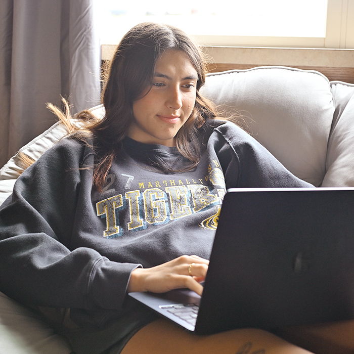 student in computer in dorms studying