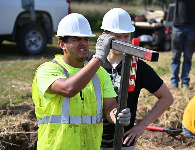 Natural Gas students working outdoors on digging projects