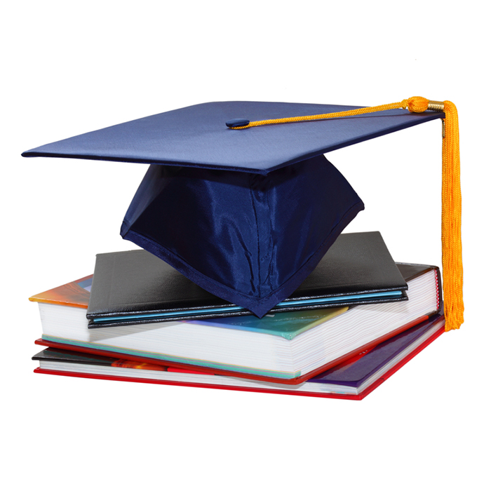 grad cap on top of books